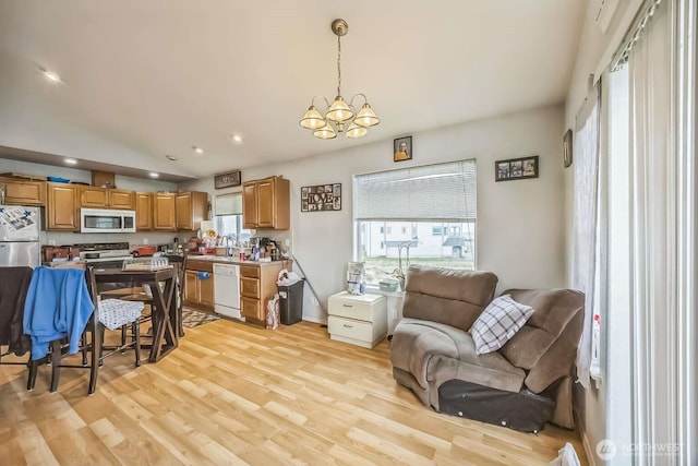 1488 Ocean Shores Blvd SW, Ocean Shores, WA 98569 - living room featuring a chandelier, recessed lighting, light wood-style flooring, and baseboards