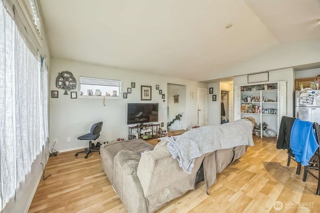 1488 Ocean Shores Blvd SW, Ocean Shores, WA 98569 - living room featuring light wood-style floors and vaulted ceiling
