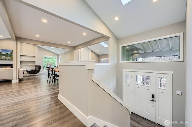 14323 SE 49th St, Bellevue, WA 98006 - foyer with vaulted ceiling, wood finished floors, baseboards, recessed lighting, and a skylight