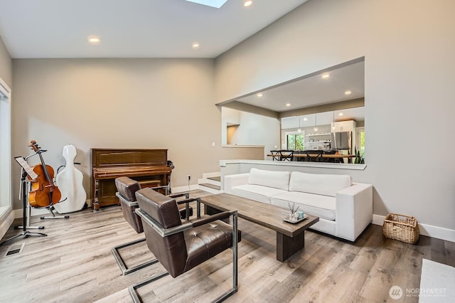 14323 SE 49th St, Bellevue, WA 98006 - living area with light wood-style floors, recessed lighting, and baseboards