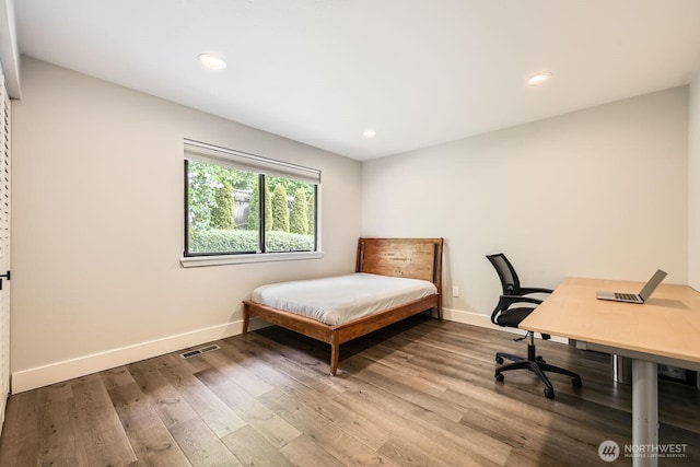 14323 SE 49th St, Bellevue, WA 98006 - bedroom with wood finished floors, baseboards, recessed lighting, and a desk