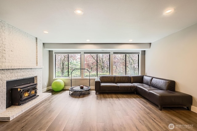 14323 SE 49th St, Bellevue, WA 98006 - living area with wood finished floors, baseboards, healthy amount of natural light, and recessed lighting