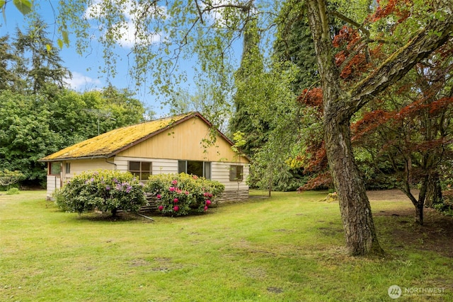 view of home's exterior featuring a lawn