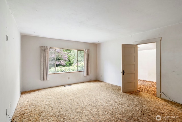 unfurnished room with carpet flooring