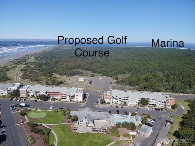 1600 W Ocean Ave Unit 1236, Westport, WA 98595 - aerial view of property and surrounding area featuring a forest and a nearby body of water