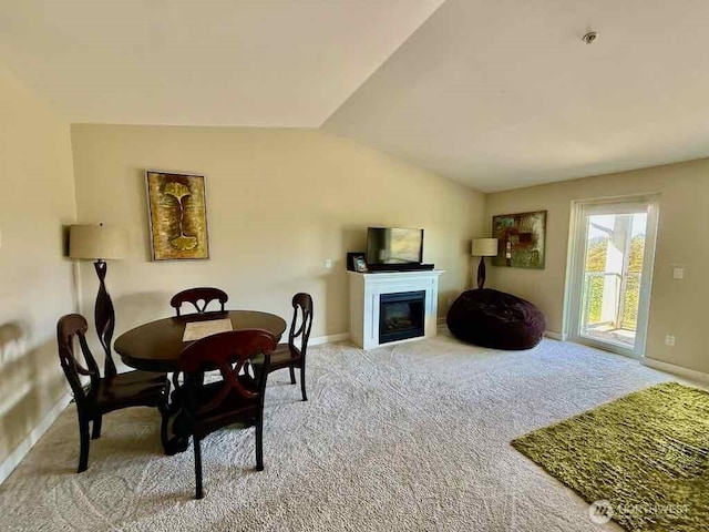 1600 W Ocean Ave Unit 1236, Westport, WA 98595 - dining room featuring vaulted ceiling, carpet floors, a fireplace, and baseboards