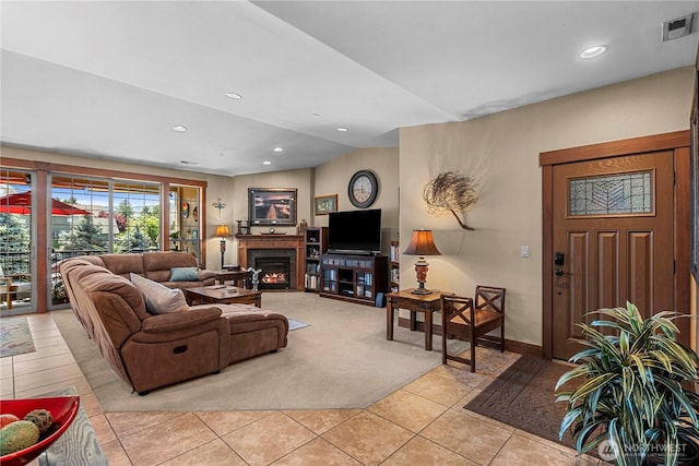 1051 N Baker Ave Unit B204, East Wenatchee, WA 98802 - living area with light tile patterned flooring, recessed lighting, a warm lit fireplace, and baseboards