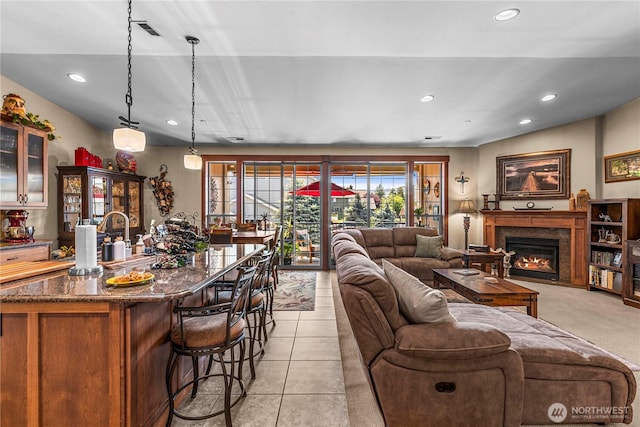 1051 N Baker Ave Unit B204, East Wenatchee, WA 98802 - living room with recessed lighting, a premium fireplace, bar with sink, and light tile patterned floors