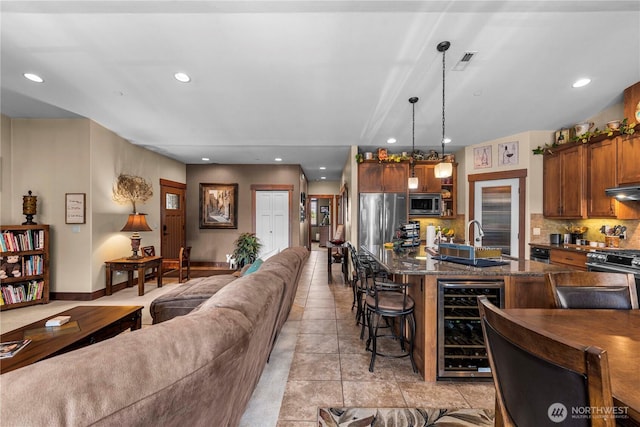1051 N Baker Ave Unit B204, East Wenatchee, WA 98802 - living area featuring wine cooler and recessed lighting