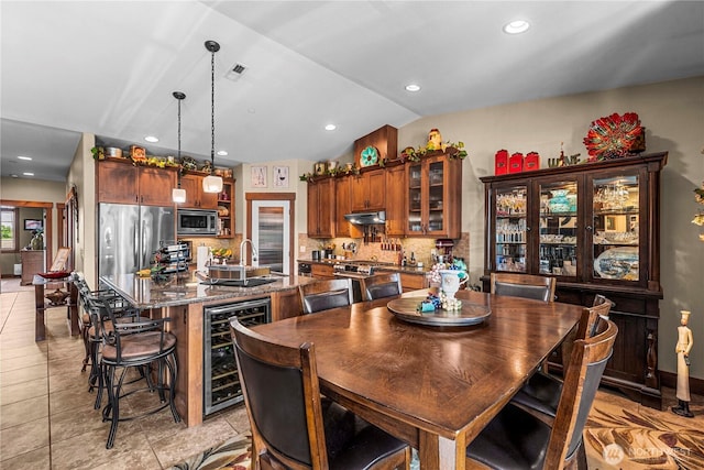 1051 N Baker Ave Unit B204, East Wenatchee, WA 98802 - dining room with wine cooler, vaulted ceiling, recessed lighting, and light tile patterned flooring
