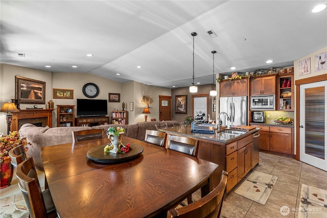 1051 N Baker Ave Unit B204, East Wenatchee, WA 98802 - dining room featuring recessed lighting, lofted ceiling, and light tile patterned floors