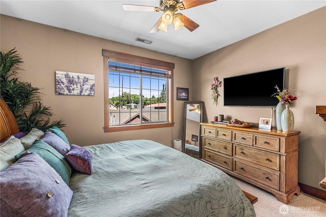 1051 N Baker Ave Unit B204, East Wenatchee, WA 98802 - bedroom featuring light colored carpet, baseboards, and ceiling fan
