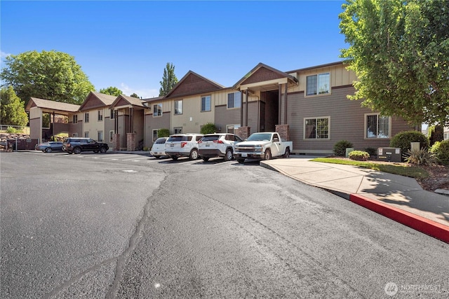 1051 N Baker Ave Unit B204, East Wenatchee, WA 98802 - view of asphalt road featuring a residential view