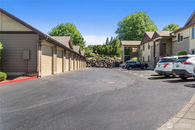1051 N Baker Ave Unit B204, East Wenatchee, WA 98802 - view of asphalt road featuring community garages
