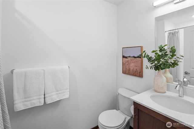 full bath featuring toilet and vanity
