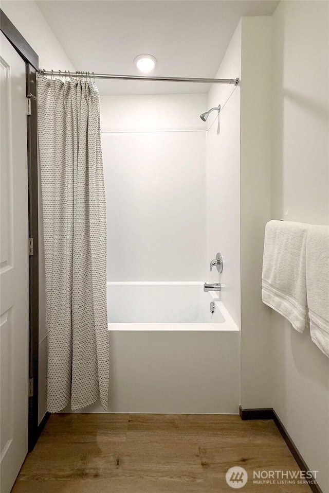 full bath with shower / bathtub combination with curtain, wood finished floors, and recessed lighting