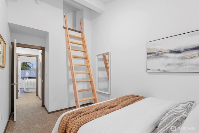 carpeted bedroom with baseboards