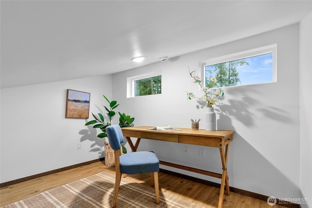 office featuring baseboards and wood finished floors