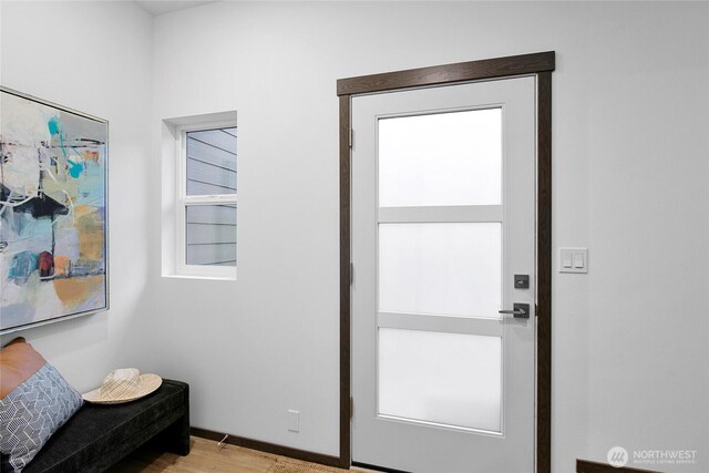 doorway with light wood-style flooring