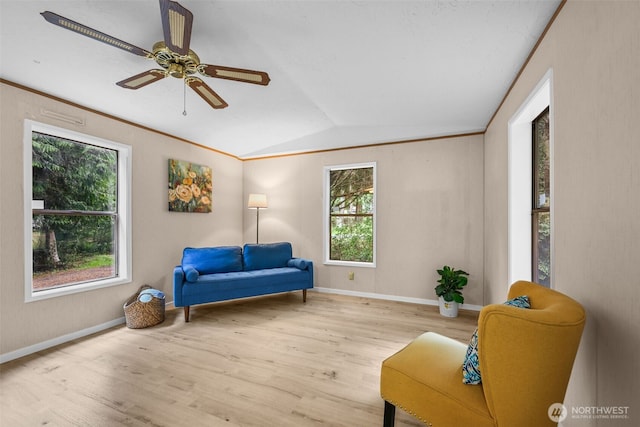 260 E Tahuya Dr, Shelton, WA 98584 - living area featuring wood finished floors, lofted ceiling, a ceiling fan, and baseboards