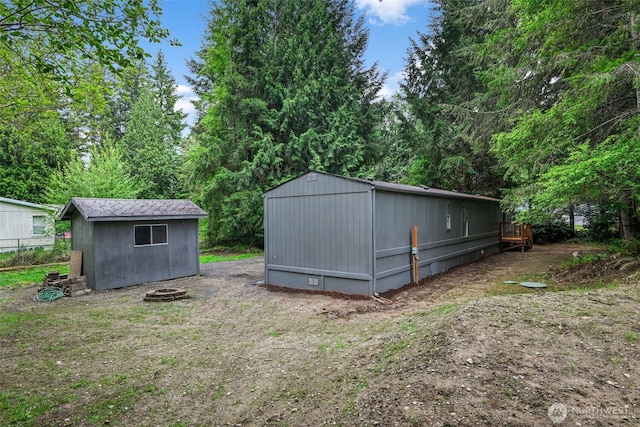 260 E Tahuya Dr, Shelton, WA 98584 - view of yard with an outdoor structure and a storage unit