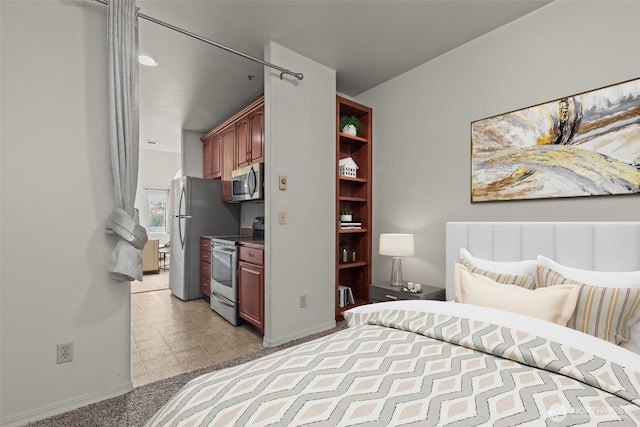 3501 Colby Ave Unit 301, Everett, WA 98201 - bedroom featuring freestanding refrigerator and baseboards