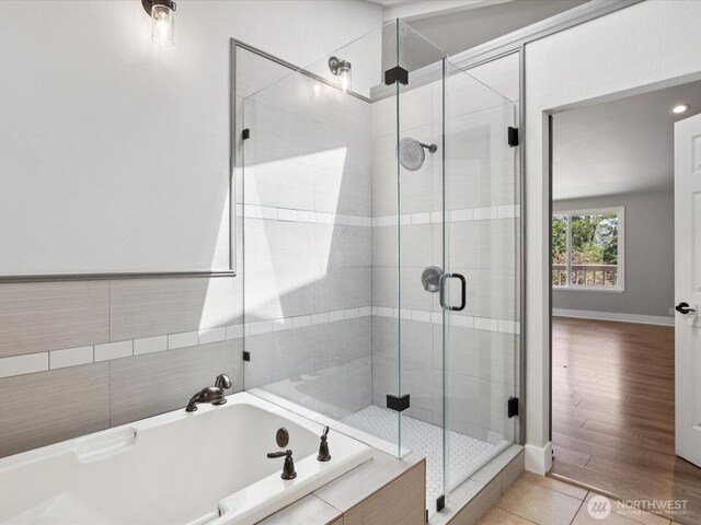 7315 294th St NE, Arlington, WA 98223 - full bathroom featuring a garden tub, a shower stall, and tile patterned floors
