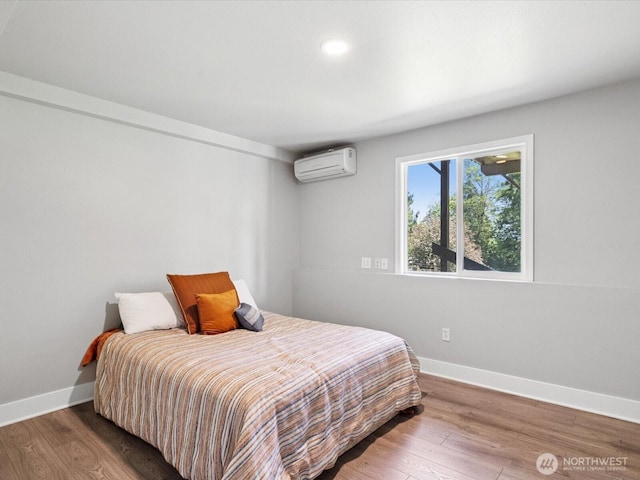 7315 294th St NE, Arlington, WA 98223 - bedroom featuring a wall mounted AC, wood finished floors, and recessed lighting