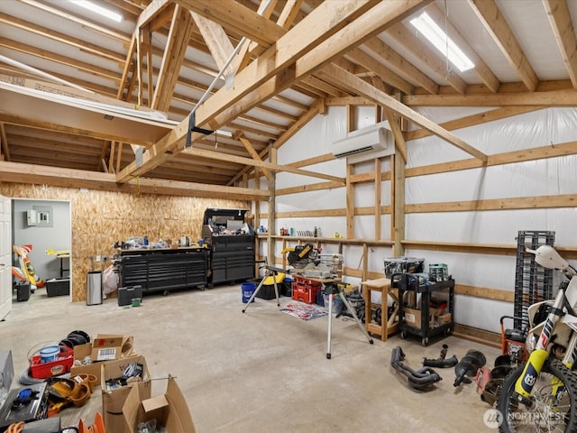7315 294th St NE, Arlington, WA 98223 - garage featuring a workshop area and a wall mounted air conditioner
