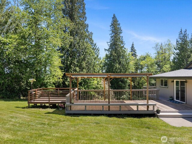 7315 294th St NE, Arlington, WA 98223 - view of grassy yard with a deck