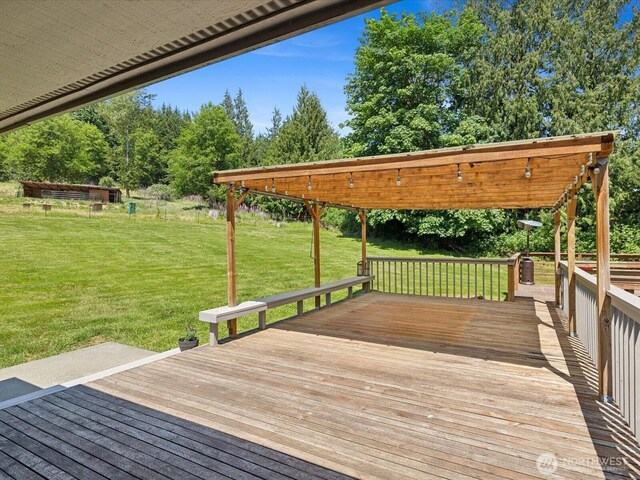 7315 294th St NE, Arlington, WA 98223 - wooden terrace featuring a lawn and view of wooded area
