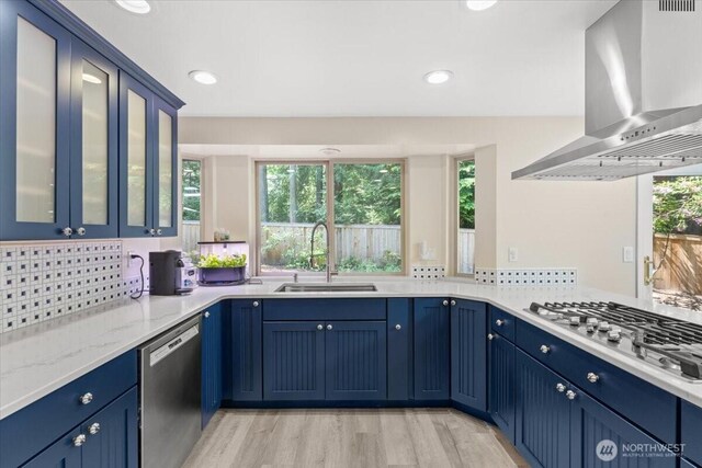 447 E Pointes Dr E, Shelton, WA 98584 - kitchen featuring wall chimney range hood, stainless steel appliances, a sink, healthy amount of natural light, and recessed lighting