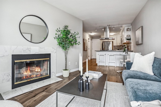 769 Hayes St Unit 504, Seattle, WA 98109 - living area featuring wood finished floors and a fireplace