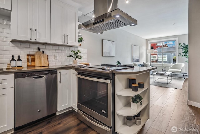 769 Hayes St Unit 504, Seattle, WA 98109 - kitchen featuring stainless steel appliances, island range hood, dark countertops, a peninsula, and open shelves