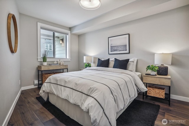 769 Hayes St Unit 504, Seattle, WA 98109 - bedroom featuring wood finished floors, baseboards, and a baseboard heating unit