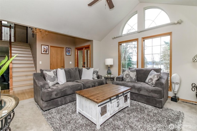 2634 59th Ave NW, Olympia, WA 98502 - living room with ceiling fan, stairway, and high vaulted ceiling