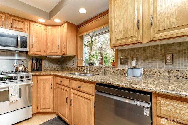 2634 59th Ave NW, Olympia, WA 98502 - kitchen with appliances with stainless steel finishes, light stone counters, decorative backsplash, and recessed lighting