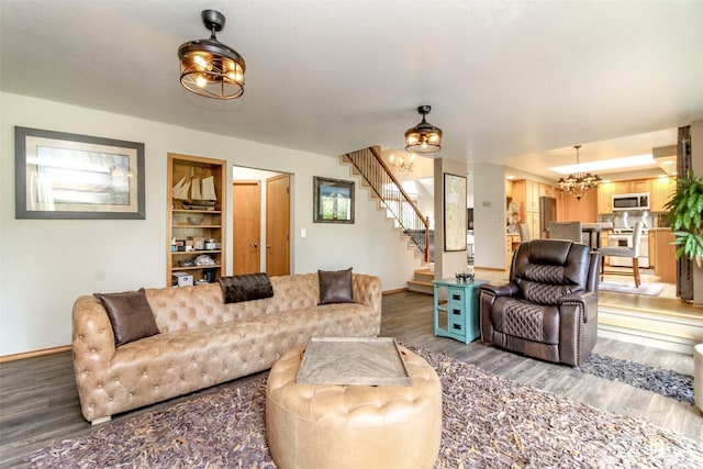 2634 59th Ave NW, Olympia, WA 98502 - living area featuring a chandelier, wood finished floors, and stairs