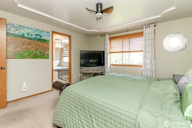 2634 59th Ave NW, Olympia, WA 98502 - carpeted bedroom with connected bathroom, ceiling fan, and a raised ceiling
