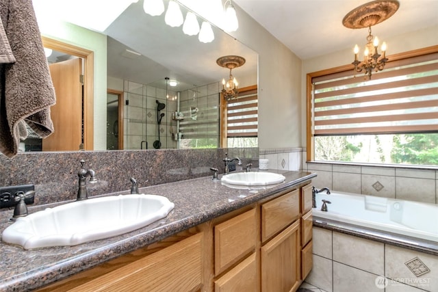 2634 59th Ave NW, Olympia, WA 98502 - full bathroom with a chandelier, a stall shower, double vanity, and a bath