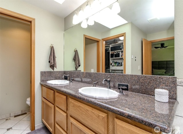 2634 59th Ave NW, Olympia, WA 98502 - bathroom with double vanity and a skylight