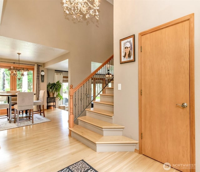2634 59th Ave NW, Olympia, WA 98502 - entrance foyer featuring a chandelier, wood finished floors, stairs, and a high ceiling