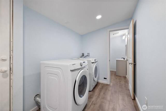 1140 Tacoma Ave, Port Orchard, WA 98366 - laundry area featuring independent washer and dryer, light wood-style floors, baseboards, and recessed lighting