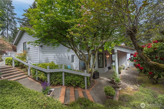 view of property hidden behind natural elements