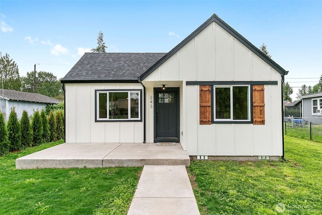 243 Carolina St, Longview, WA 98632 - view of front of property with board and batten siding and a shingled roof