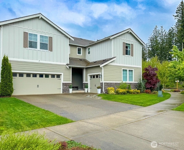 32938 Ash Ave SE, Black Diamond, WA 98010 - view of front of home with board and batten siding, an attached garage, stone siding, and driveway
