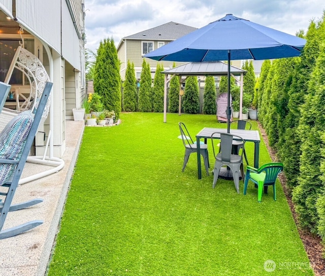 32938 Ash Ave SE, Black Diamond, WA 98010 - view of grassy yard with a gazebo and outdoor dining space
