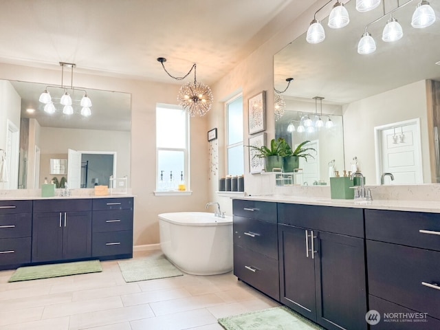 32938 Ash Ave SE, Black Diamond, WA 98010 - full bath featuring a freestanding tub, two vanities, a chandelier, and tile patterned floors