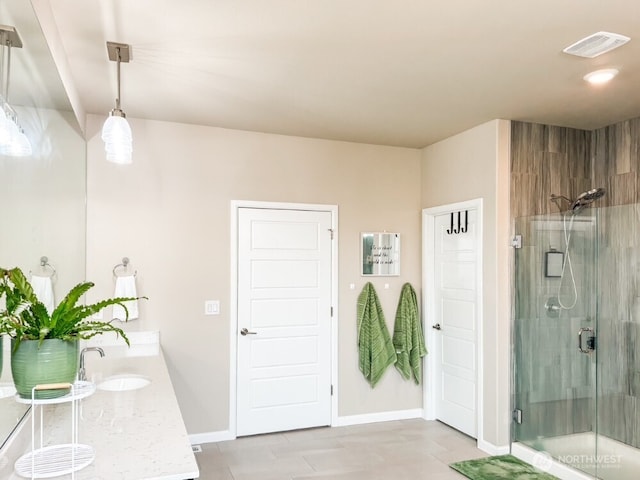 32938 Ash Ave SE, Black Diamond, WA 98010 - bathroom with a shower stall, vanity, and baseboards