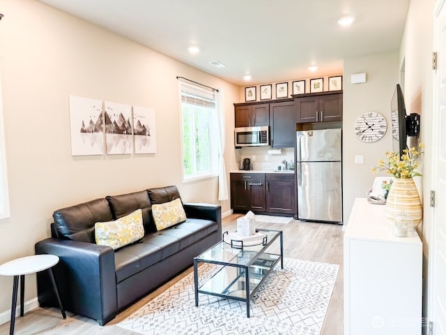 32938 Ash Ave SE, Black Diamond, WA 98010 - living room with light wood finished floors, recessed lighting, and baseboards